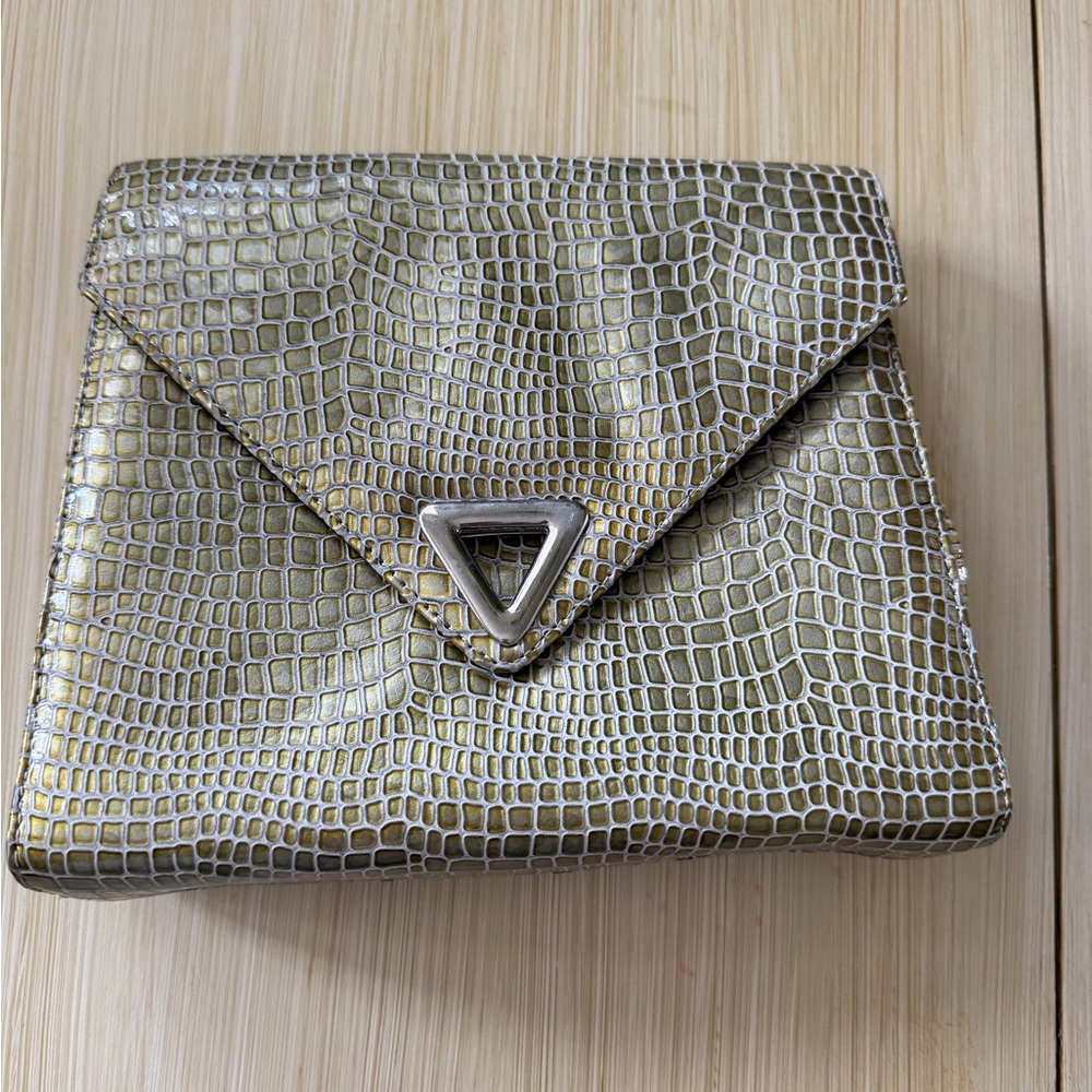 crocodile-embossed leather vintage clutch from the designer Timothy Hitsman
